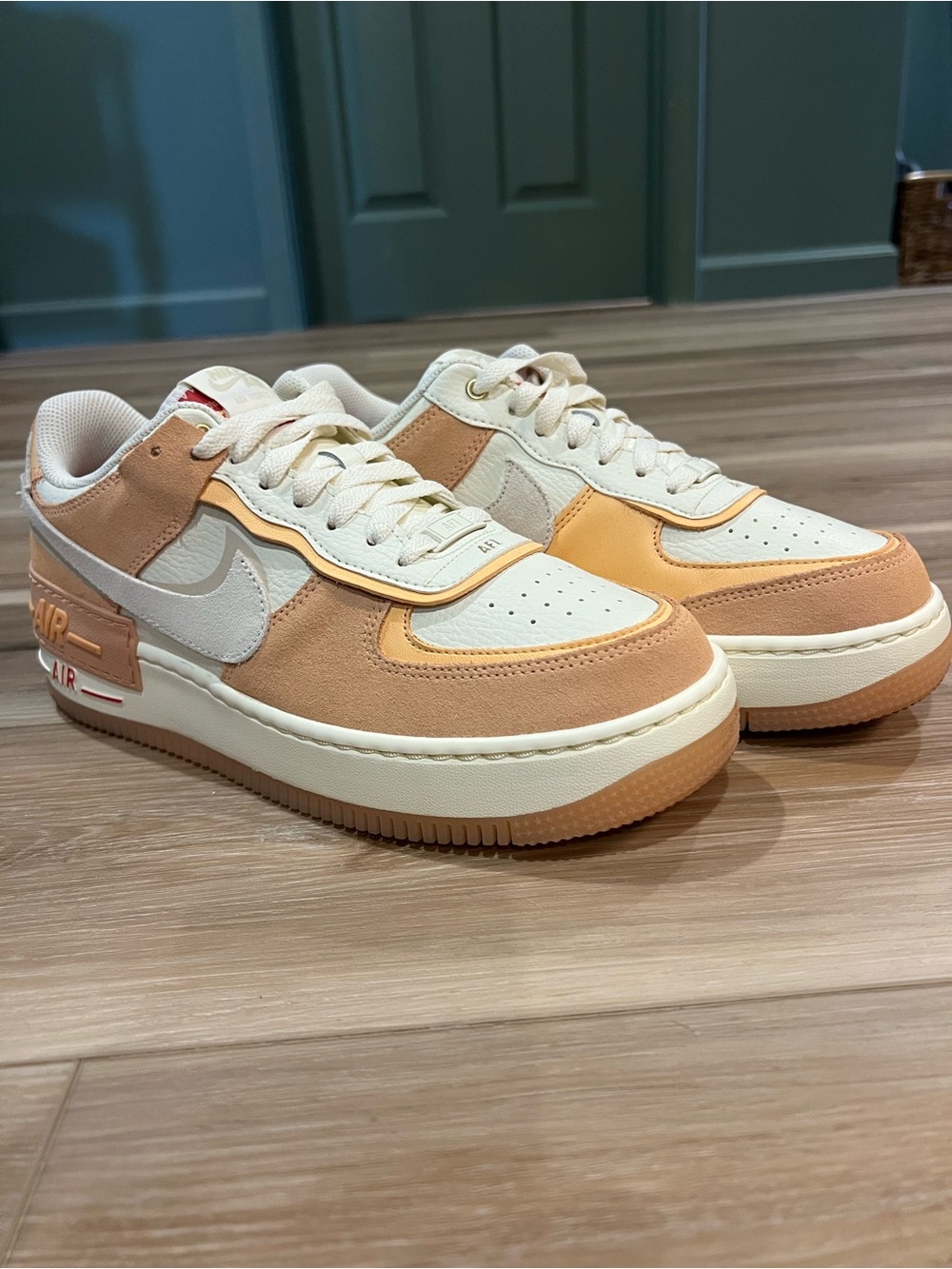 Nike Women’s Low-Top Sneakers in Cream and Peach